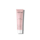 Pink bottle of Paradox repair conditioner on a white background