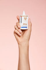 Ultrasun SPF50+ Tinted Face Fluid 40ml hand holding
